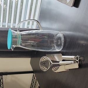 Glass tea pitcher, 2 spatulas and potato masher